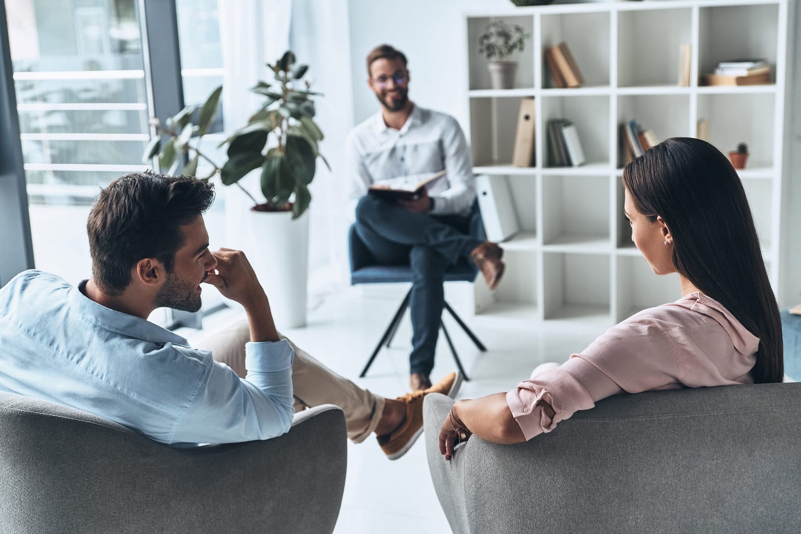 Married couple participating in an online therapy session with a family therapist