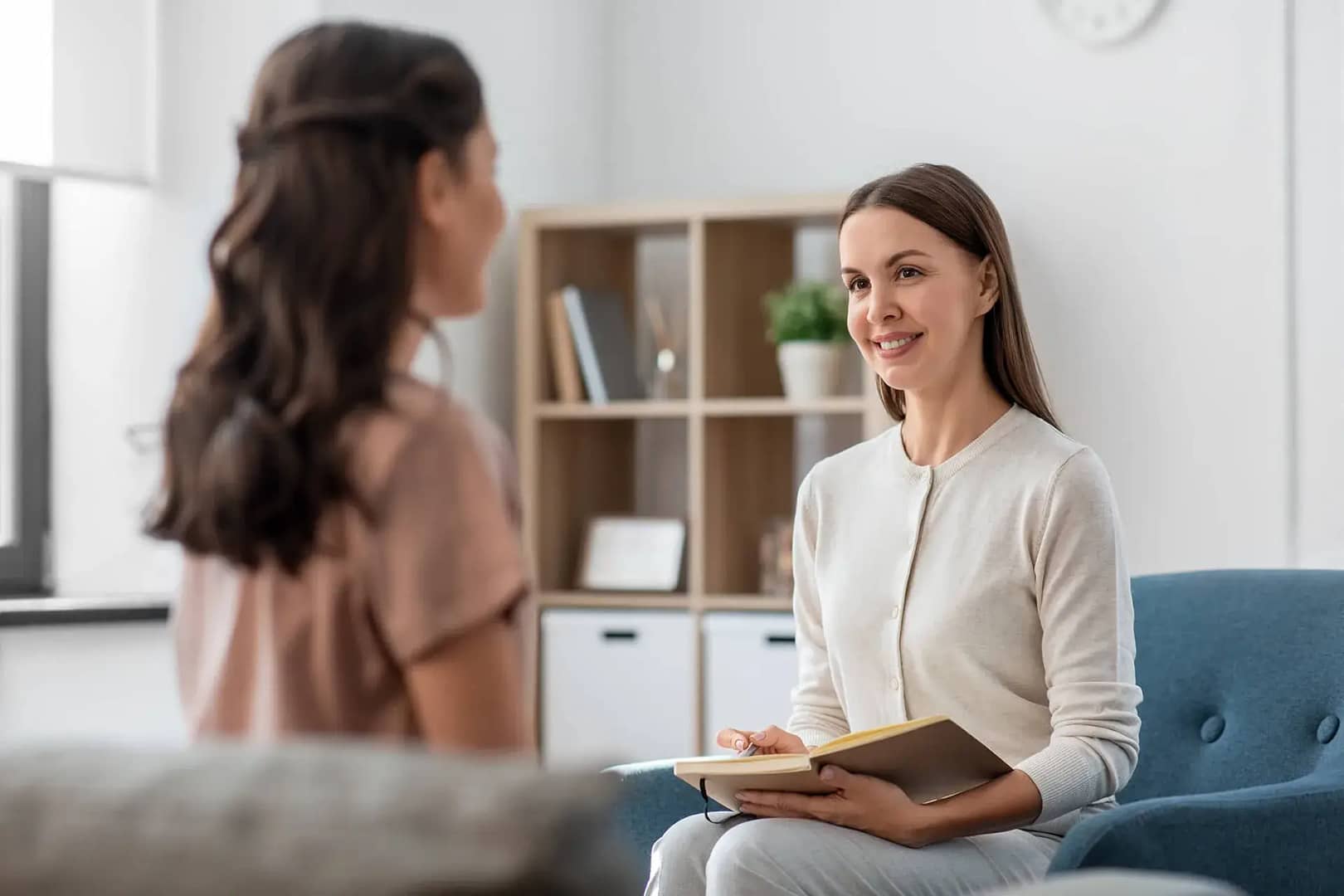 Therapist and female patient collaborating during a therapy session for eating disorders and neurodiversity support